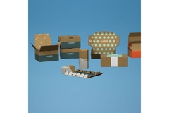 Image Assorted branded cardboard packaging boxes and inserts on blue background